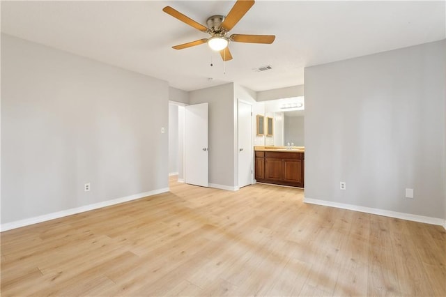 interior space featuring ceiling fan, sink, and light hardwood / wood-style floors