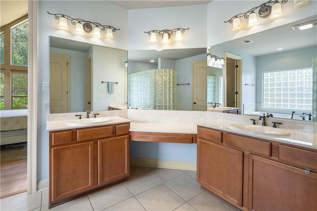 bathroom with vanity and tile patterned flooring