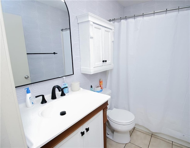 bathroom with vanity, tile patterned floors, and toilet