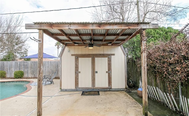 view of outbuilding featuring a fenced in pool