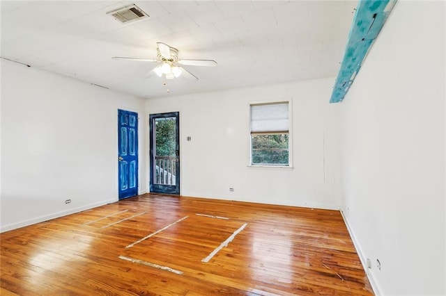 spare room featuring hardwood / wood-style flooring and ceiling fan