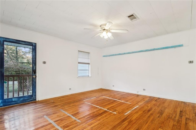 empty room featuring hardwood / wood-style floors and ceiling fan