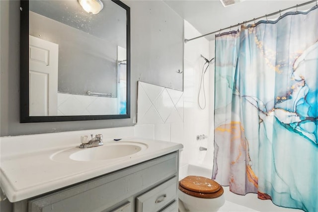 full bathroom featuring vanity, toilet, tile walls, and shower / bath combo with shower curtain