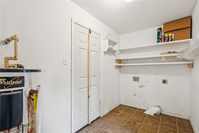 clothes washing area with electric dryer hookup, washer hookup, and water heater