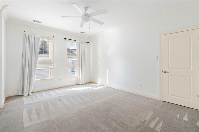 unfurnished living room featuring ceiling fan with notable chandelier, ornamental molding, and hardwood / wood-style floors