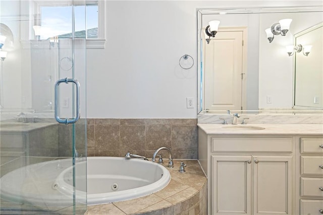 bathroom featuring vanity and shower with separate bathtub