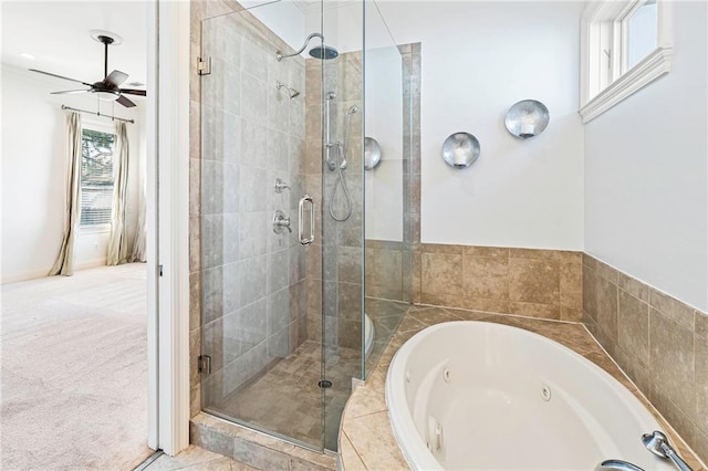 bathroom featuring shower with separate bathtub and ceiling fan