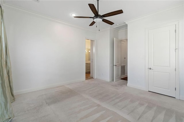 unfurnished bedroom featuring ornamental molding, light carpet, ceiling fan, and ensuite bathroom