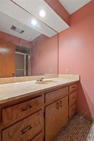 bathroom with vanity and tile patterned flooring