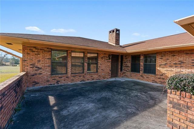 rear view of property featuring a patio area