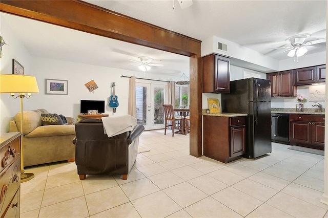 kitchen with light tile patterned floors, ceiling fan, dark brown cabinets, black appliances, and french doors