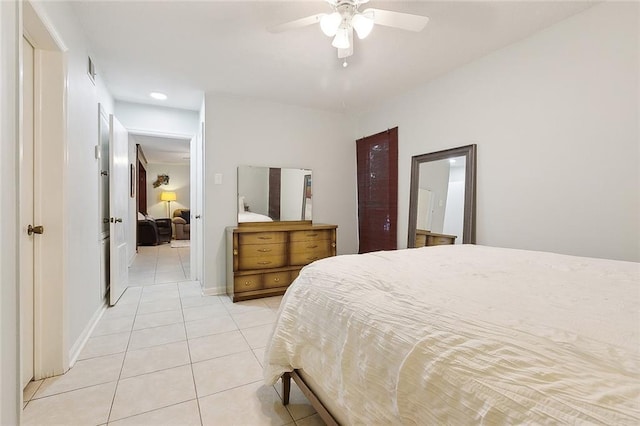 tiled bedroom featuring ceiling fan