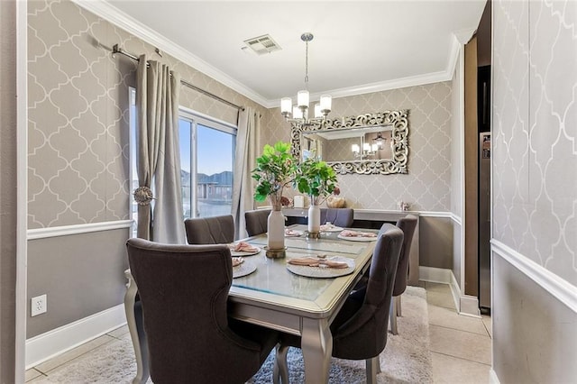 dining space with ornamental molding, light tile patterned floors, and a notable chandelier