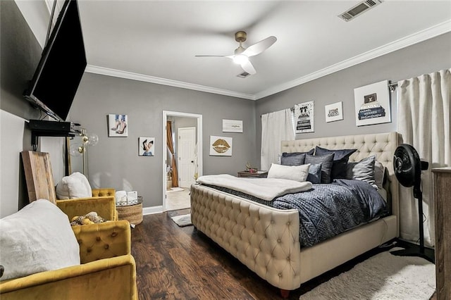 bedroom featuring ornamental molding, dark hardwood / wood-style floors, and ceiling fan