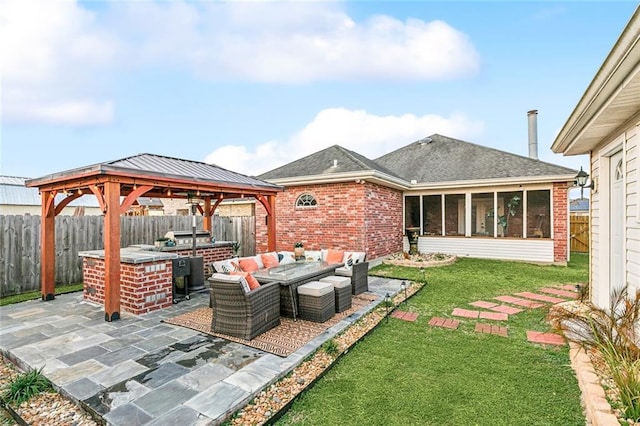 view of patio with a gazebo, a sunroom, and an outdoor hangout area