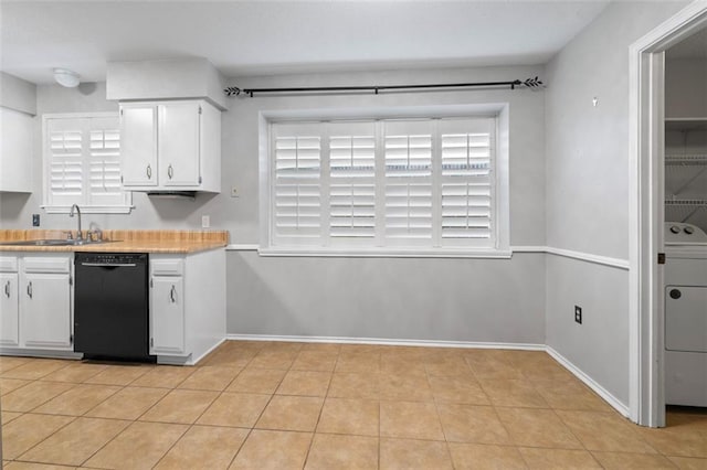 kitchen featuring light tile patterned flooring, washer / clothes dryer, white cabinetry, dishwasher, and sink