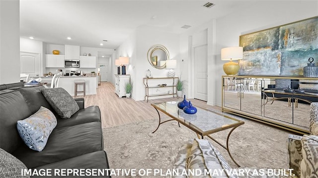 living room with light hardwood / wood-style floors