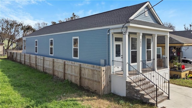 view of home's exterior with a lawn