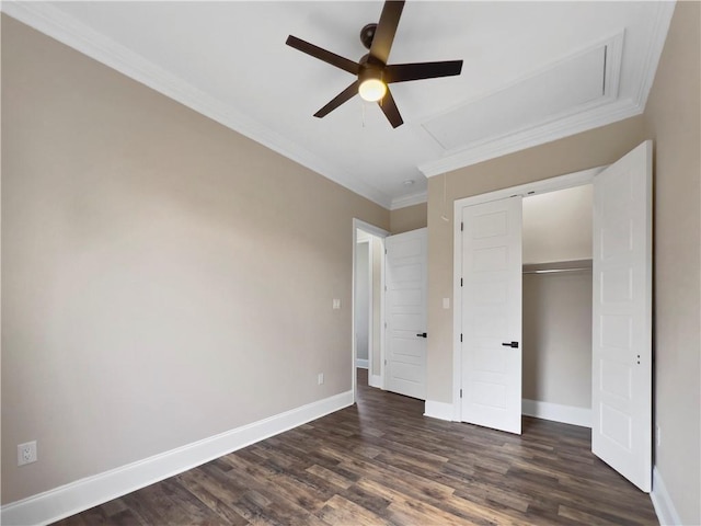 unfurnished bedroom with crown molding, ceiling fan, dark hardwood / wood-style floors, and a closet