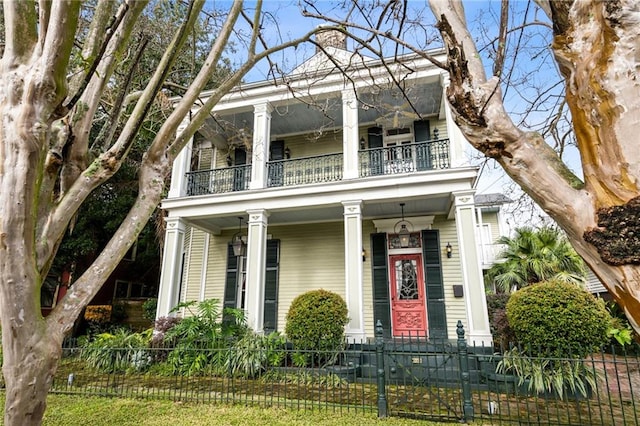 1555 N Miro St, New Orleans, LA 70119 - greek revival inspired property with a balcony, a fenced front yard, and a porch