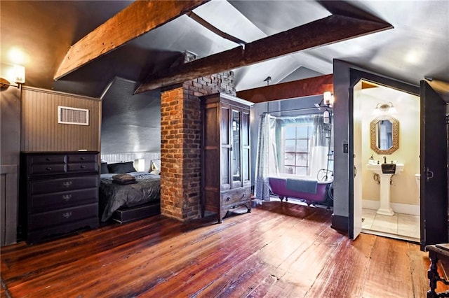 1555 N Miro St, New Orleans, LA 70119 - bedroom with hardwood / wood-style floors and ensuite bathroom