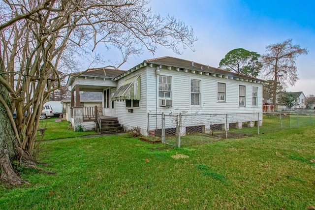 back of house featuring a yard