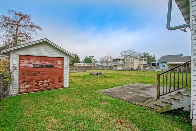 view of yard featuring an outbuilding and a garage