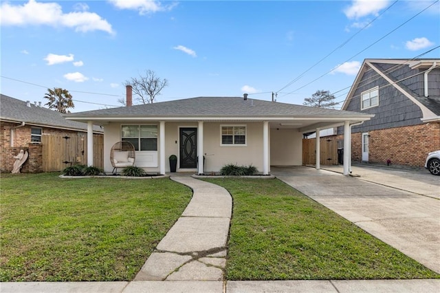 view of front facade with a carport and a front lawn