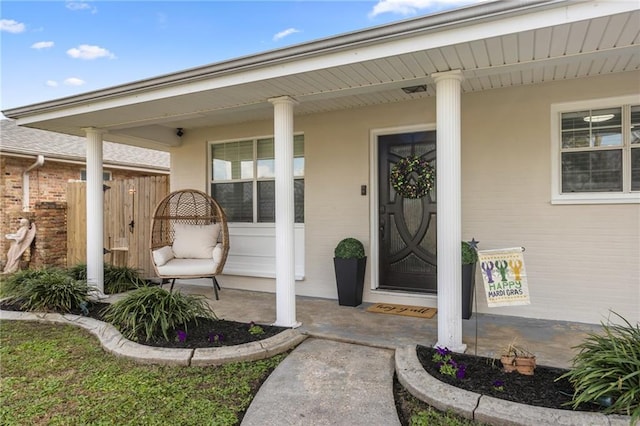 property entrance featuring covered porch