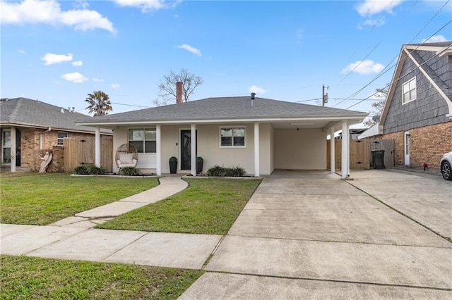 single story home with driveway, fence, a front yard, a carport, and stucco siding