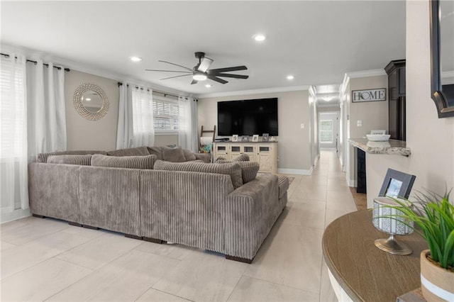 living room with crown molding, ceiling fan, and light tile patterned flooring