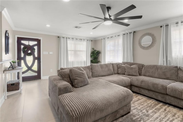 living room featuring ceiling fan and ornamental molding