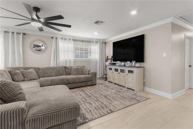 tiled living room with ornamental molding and ceiling fan