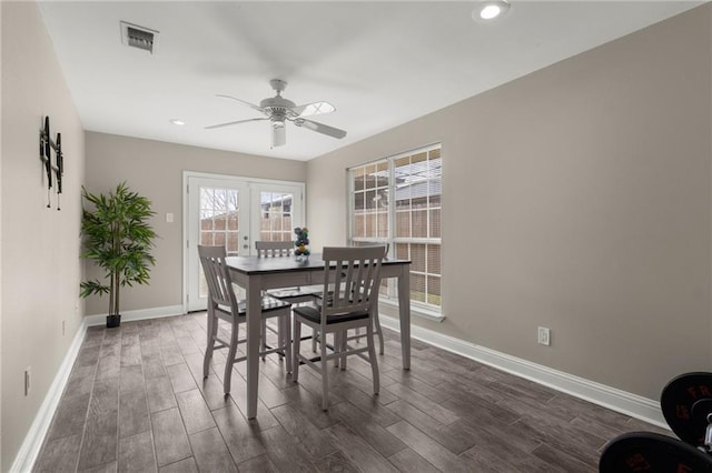 dining room with dark wood-type flooring and ceiling fan