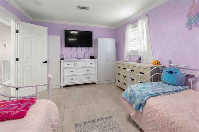 tiled bedroom featuring crown molding