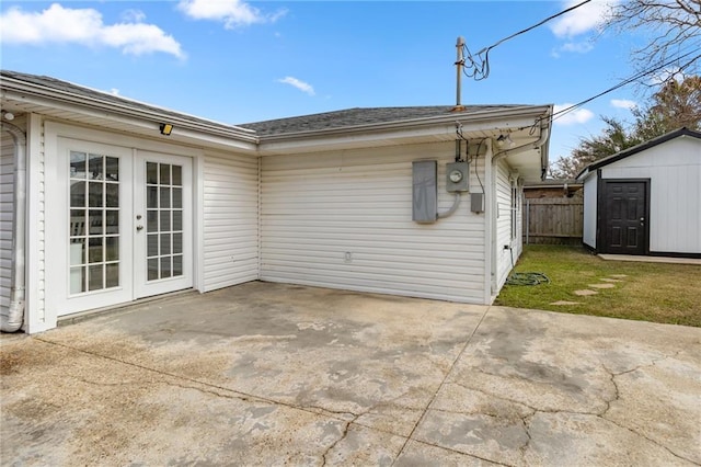 exterior space with a patio, a storage shed, french doors, and a lawn