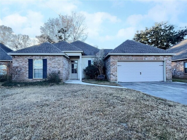 ranch-style house featuring a garage