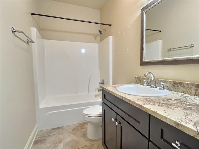 full bath featuring  shower combination, vanity, tile patterned flooring, and toilet