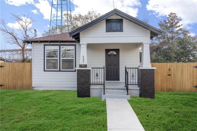 bungalow-style house featuring a front yard