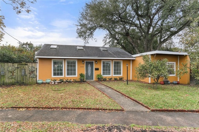 single story home with a front yard