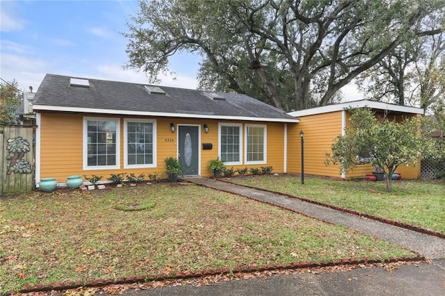 ranch-style house with a front lawn