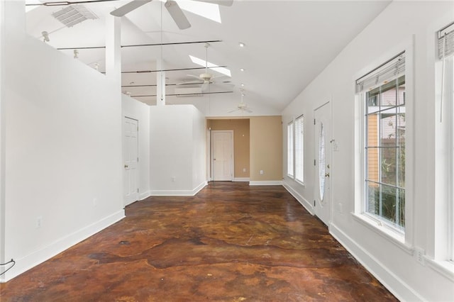 interior space featuring a skylight, high vaulted ceiling, and ceiling fan