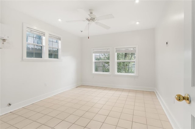 unfurnished room with ceiling fan and light tile patterned flooring