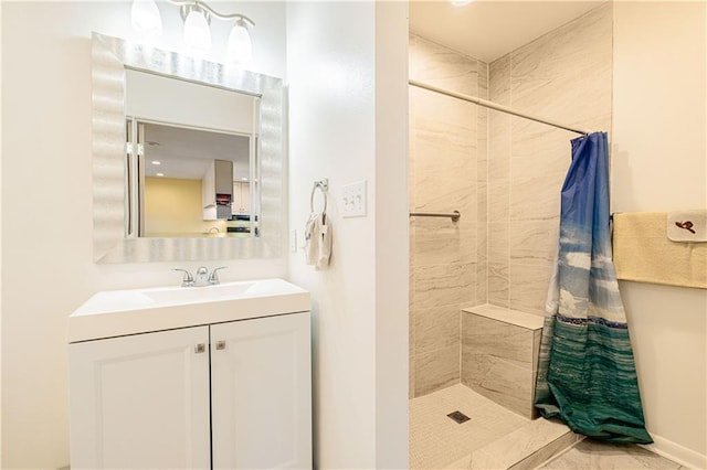 bathroom featuring vanity and a shower with shower curtain