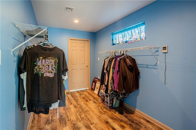 walk in closet featuring hardwood / wood-style floors