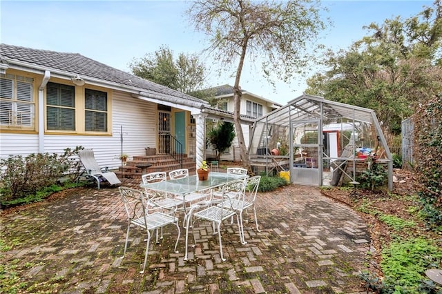 view of patio / terrace with a lanai