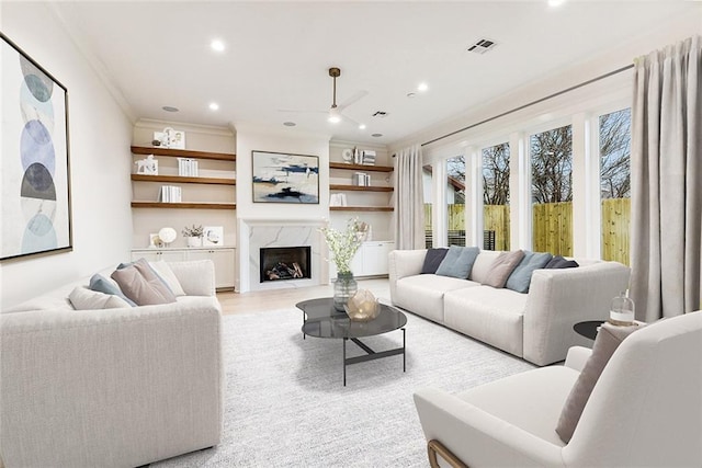 3705 Rue Emilion Dr, Metairie, LA 70002 - living room with recessed lighting, ornamental molding, light wood-type flooring, and a premium fireplace