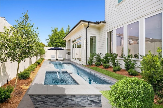 3705 Rue Emilion Dr, Metairie, LA 70002 - view of pool with a fenced backyard, a pool with connected hot tub, and a patio area
