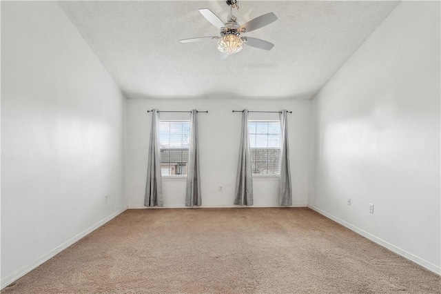 spare room with ceiling fan, carpet flooring, and a textured ceiling