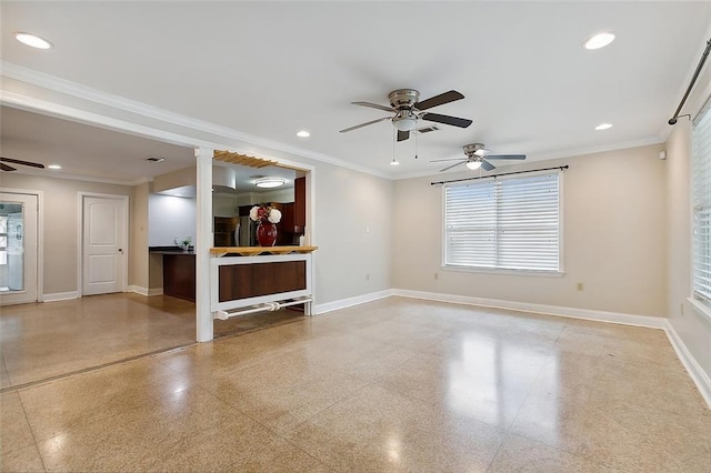 unfurnished living room with light speckled floor, crown molding, and baseboards